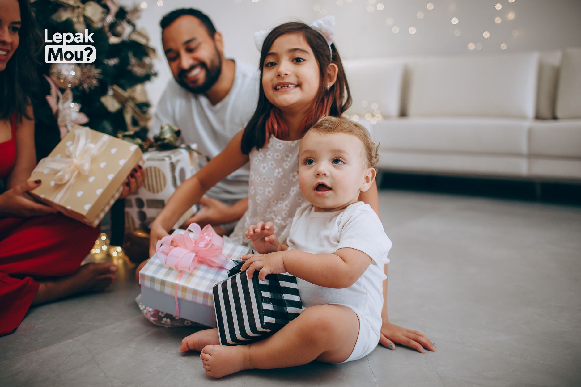 A family opening Christmas presents together