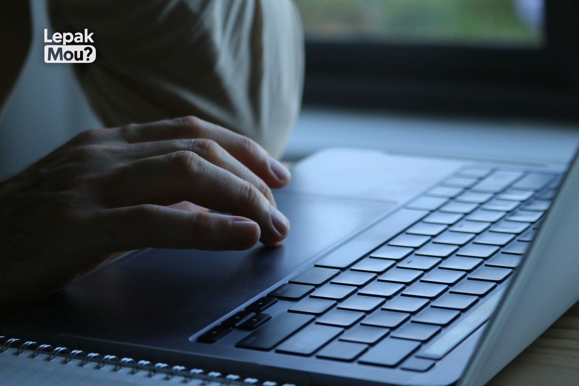 A professional considering a job offer at their desk