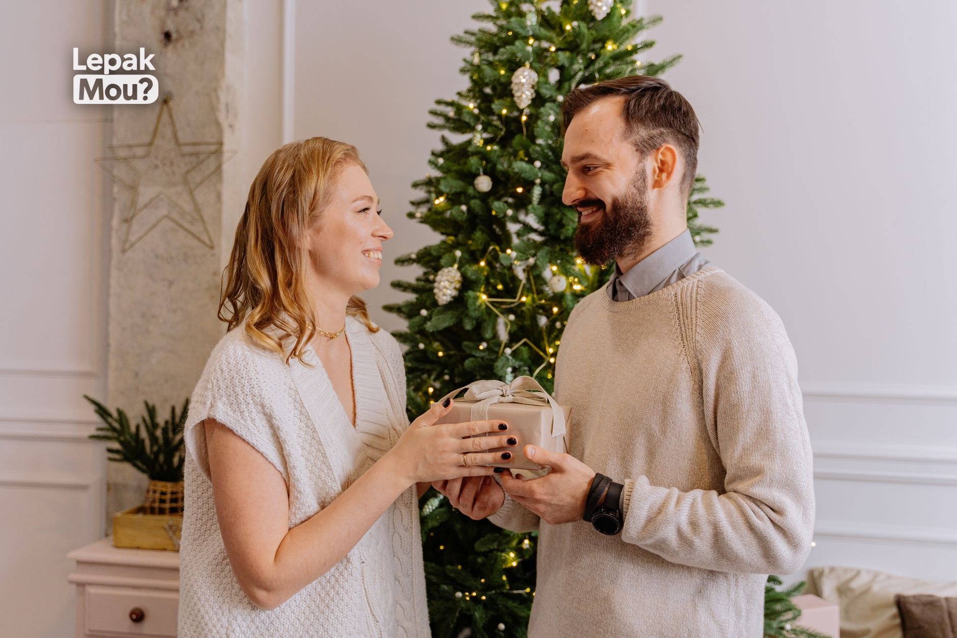 A couple exchanging Christmas gifts