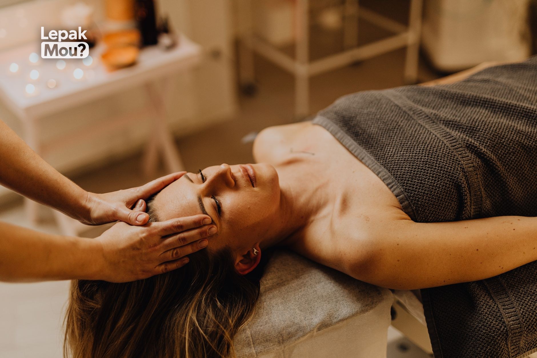 A woman receiving a facial treatment at a KL spa