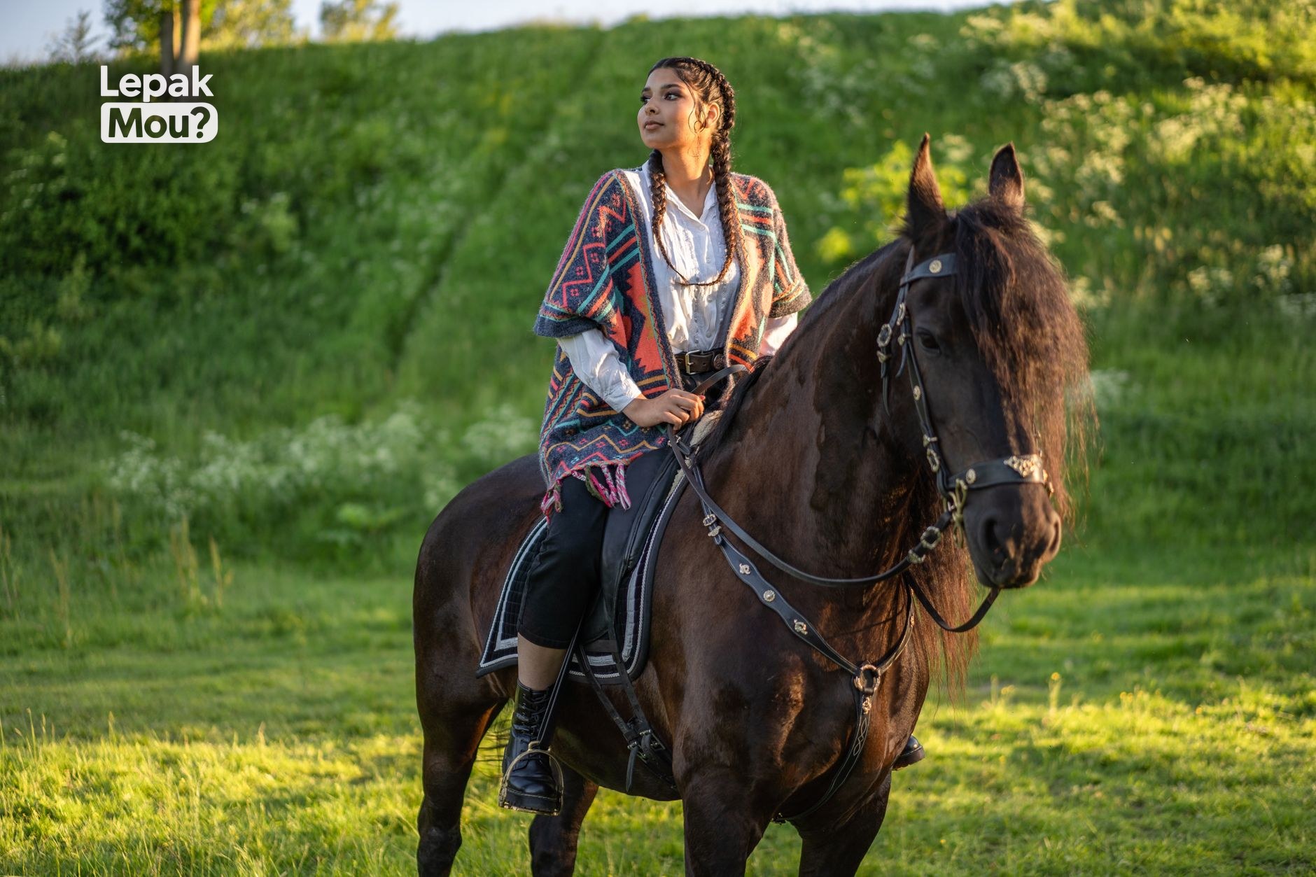 A person riding a horse outdoors